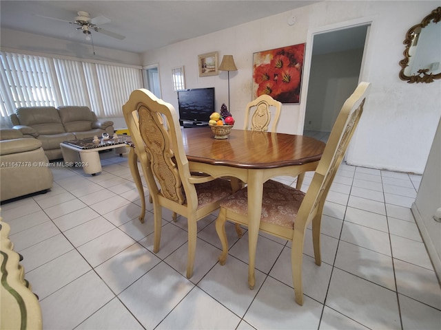 dining area featuring ceiling fan and tile patterned floors