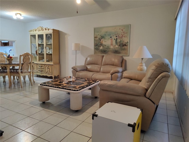 living room with light tile patterned floors and ceiling fan