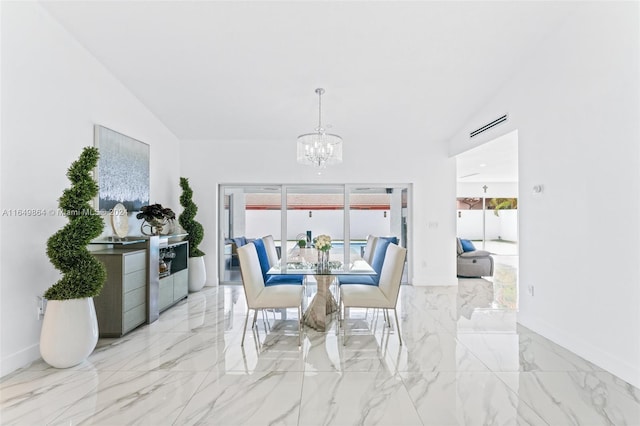 tiled dining room featuring lofted ceiling and a chandelier