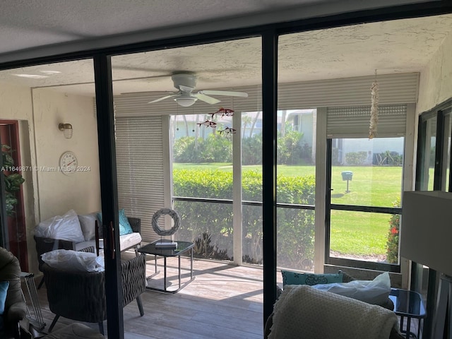 sunroom / solarium with ceiling fan