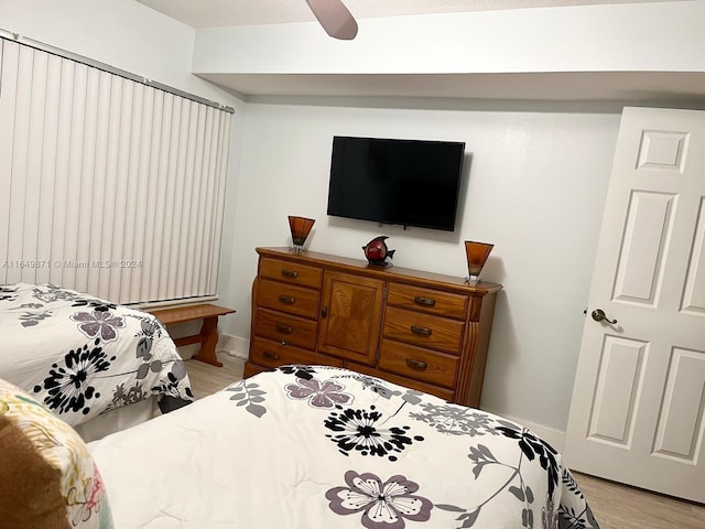 bedroom featuring light hardwood / wood-style flooring and ceiling fan