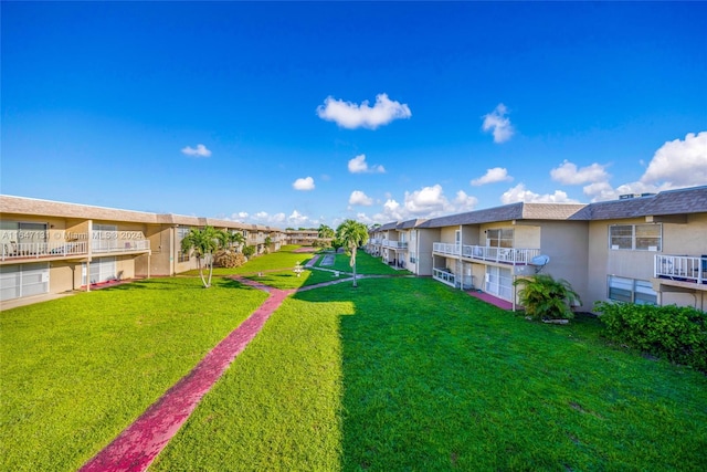 view of yard featuring a balcony