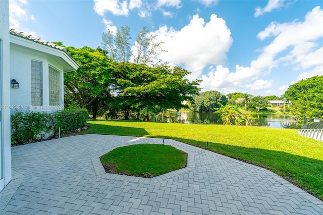 view of patio with a water view