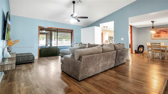 living room with dark hardwood / wood-style flooring, ceiling fan, and lofted ceiling