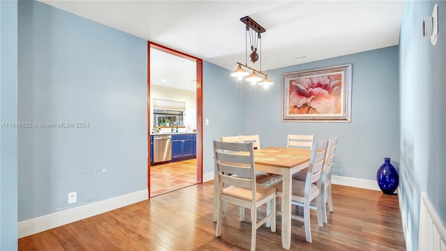 dining space with light hardwood / wood-style flooring