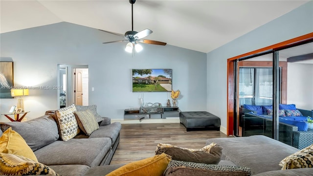 living room with lofted ceiling, ceiling fan, and hardwood / wood-style floors