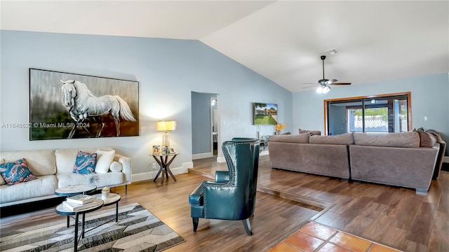 living room with lofted ceiling, hardwood / wood-style flooring, and ceiling fan