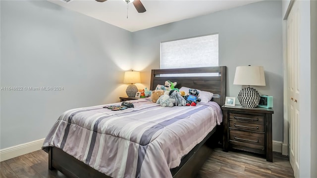 bedroom featuring hardwood / wood-style floors, ceiling fan, and a closet