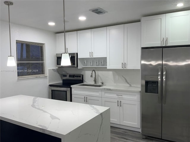 kitchen featuring white cabinets, stainless steel appliances, dark hardwood / wood-style floors, and sink