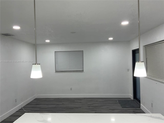 empty room featuring dark hardwood / wood-style floors