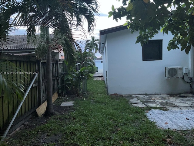 view of side of property featuring ac unit