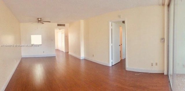 spare room featuring a textured ceiling, hardwood / wood-style floors, and ceiling fan