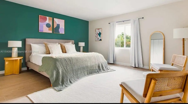 bedroom featuring hardwood / wood-style flooring