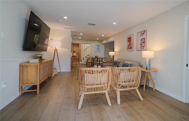 living room with light hardwood / wood-style flooring