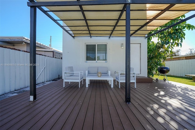 wooden terrace with an outdoor living space