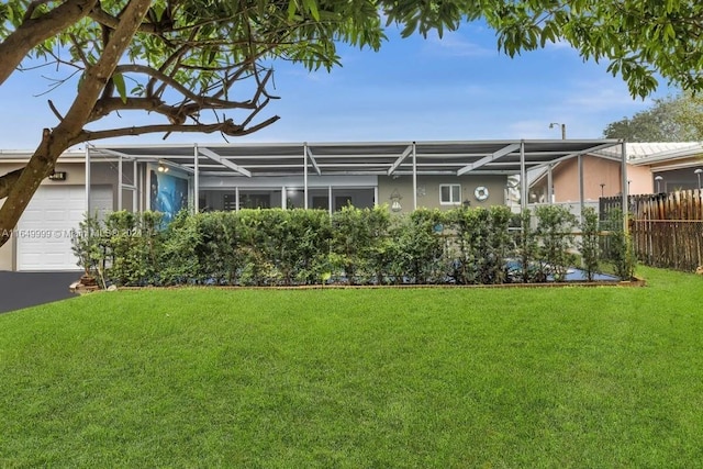 exterior space with a garage and a front yard