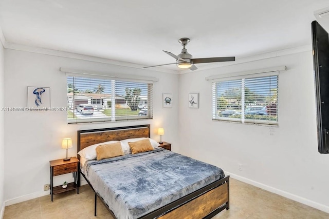 bedroom featuring crown molding and ceiling fan