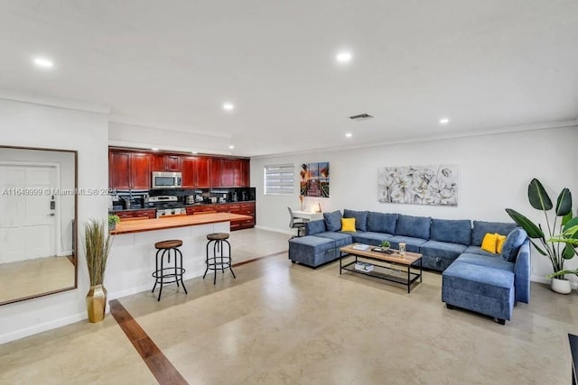 living room featuring crown molding