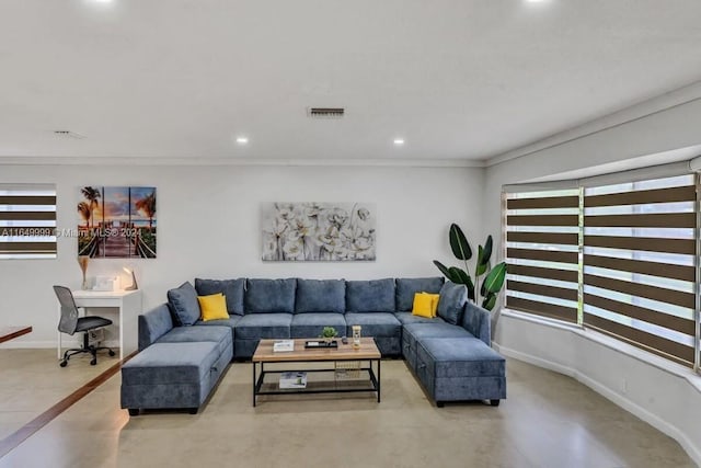 living room featuring tile patterned floors and ornamental molding