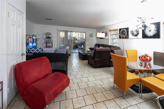 living room with light tile patterned flooring