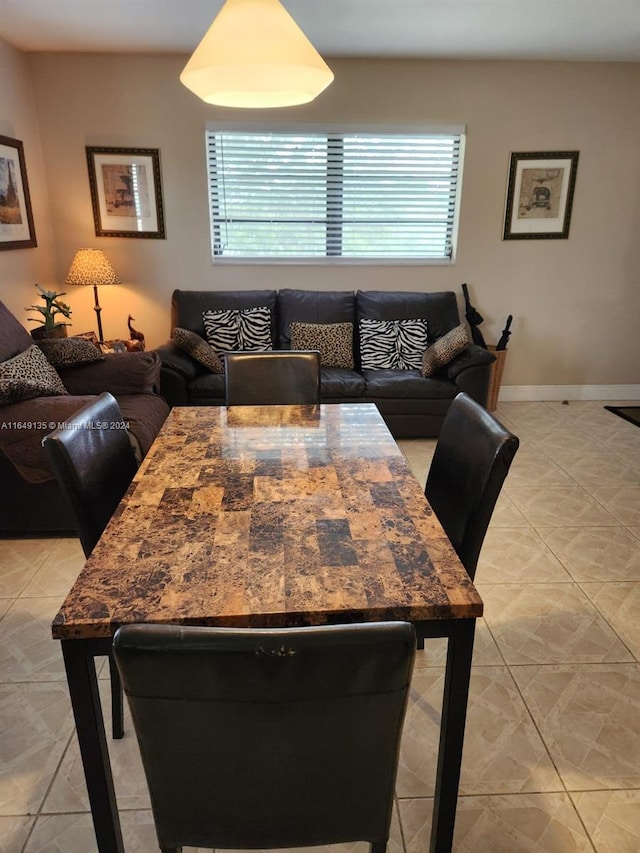 dining room featuring light tile patterned flooring