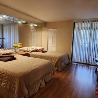 bedroom with wood-type flooring