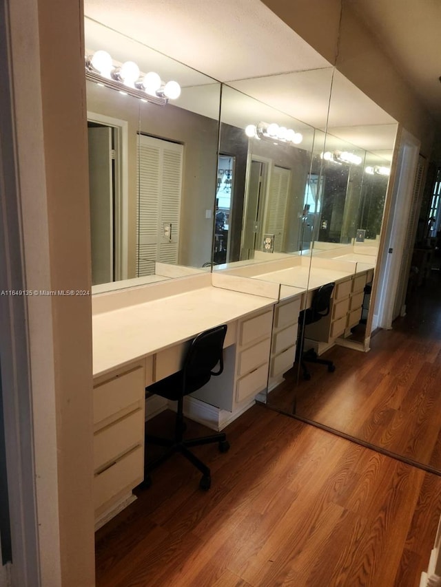 bathroom with hardwood / wood-style floors