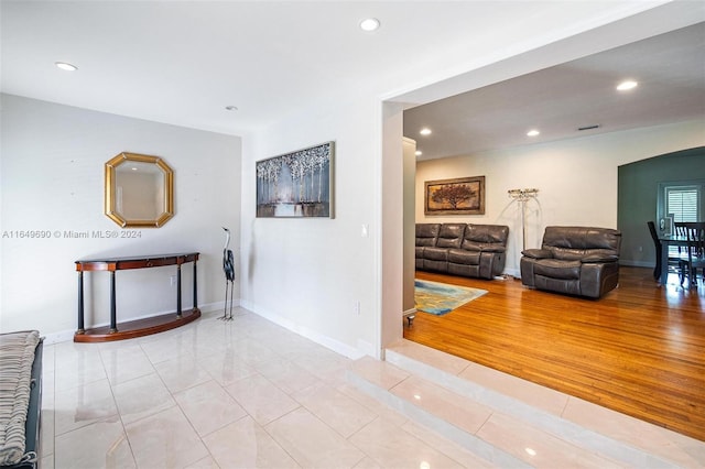 hall with light hardwood / wood-style floors