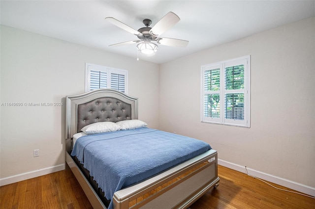 bedroom featuring dark wood-type flooring and ceiling fan