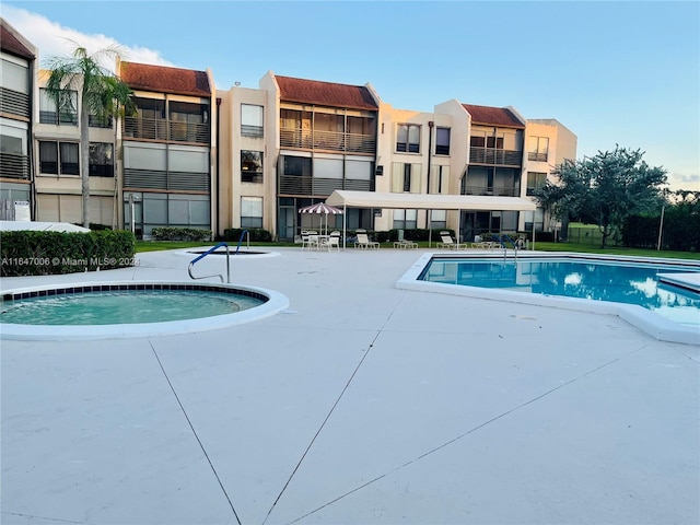 view of swimming pool with a patio