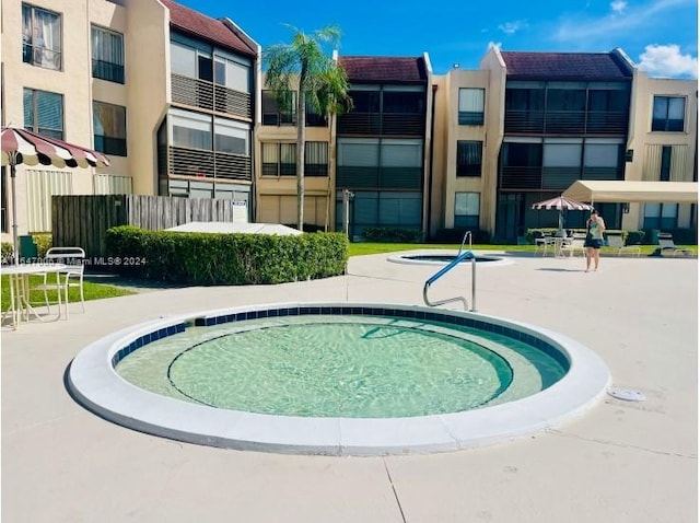 view of swimming pool featuring a patio area