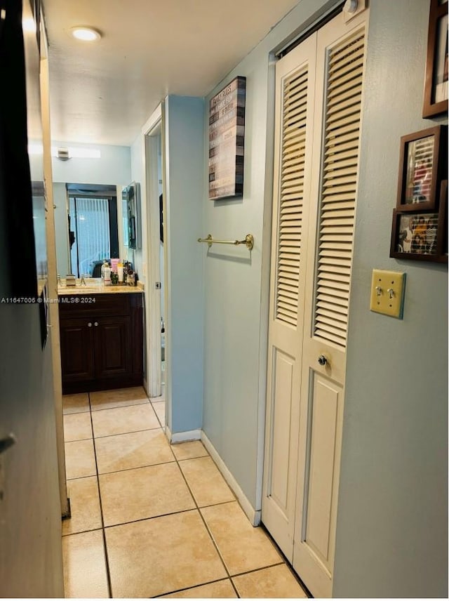 hall with light tile patterned flooring