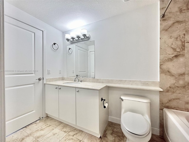 full bathroom with tile patterned floors, toilet, tub / shower combination, vanity, and a textured ceiling