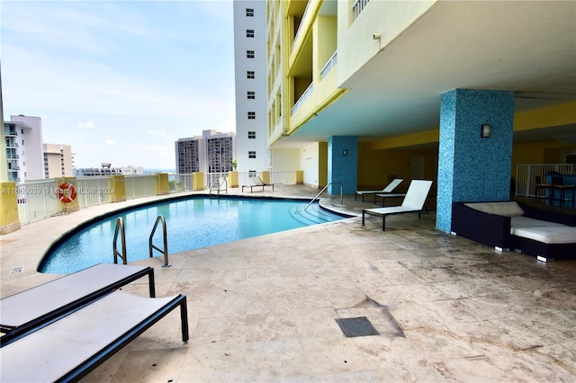 view of pool featuring a patio area