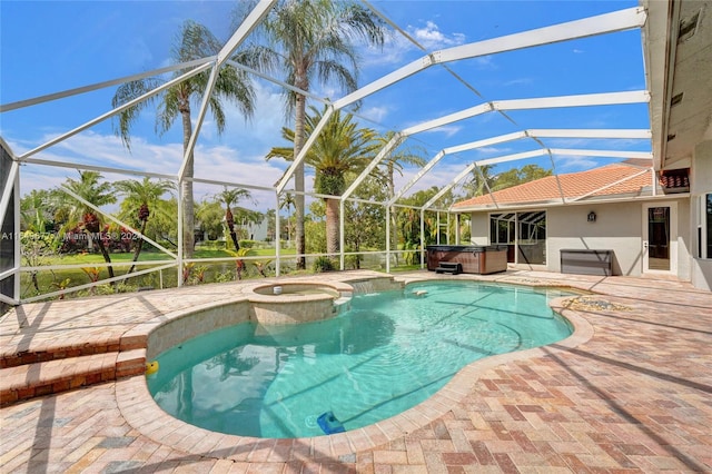 view of swimming pool with a lanai, a hot tub, and a patio area