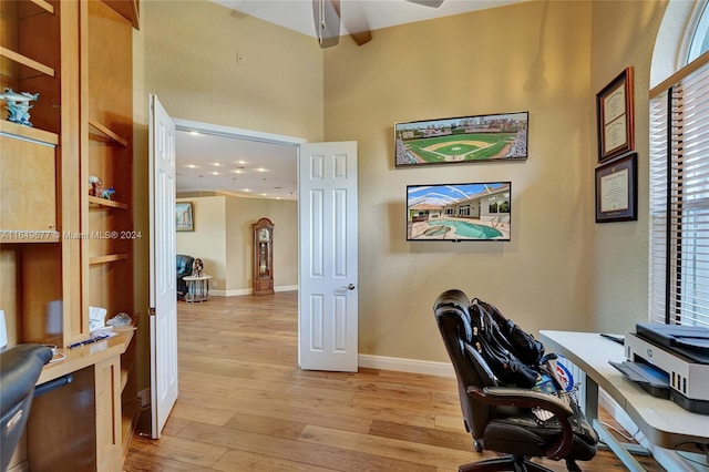 office space featuring ceiling fan and light hardwood / wood-style floors