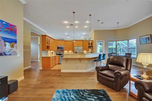 living room with light wood-type flooring and ornamental molding