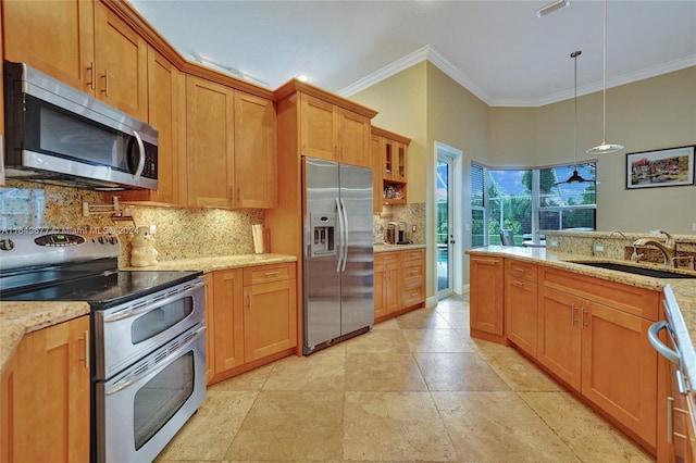 kitchen with decorative light fixtures, light stone countertops, stainless steel appliances, sink, and tasteful backsplash