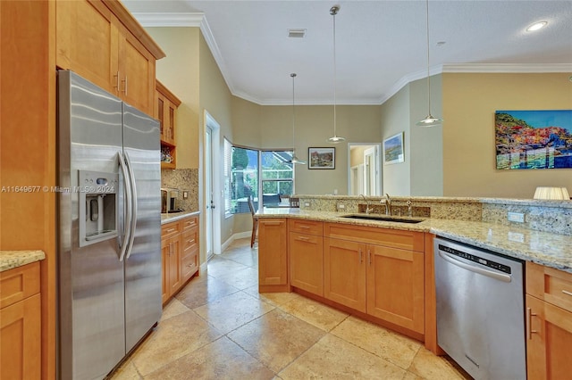 kitchen featuring pendant lighting, light stone counters, stainless steel appliances, and sink