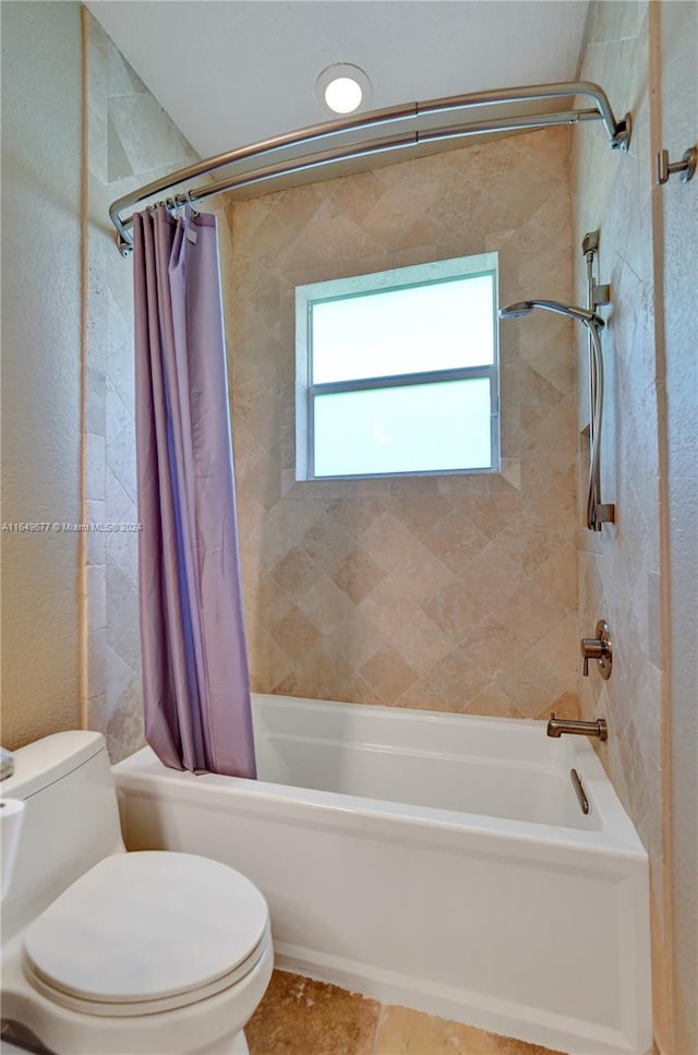 bathroom with toilet and shower / tub combo