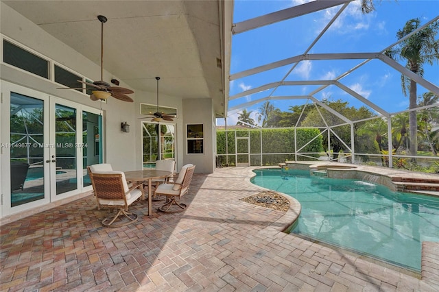 view of pool with french doors, a lanai, a patio area, and ceiling fan