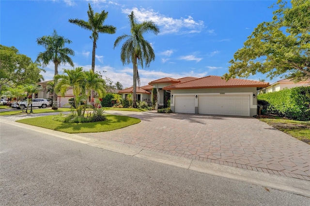 view of front of property with a garage