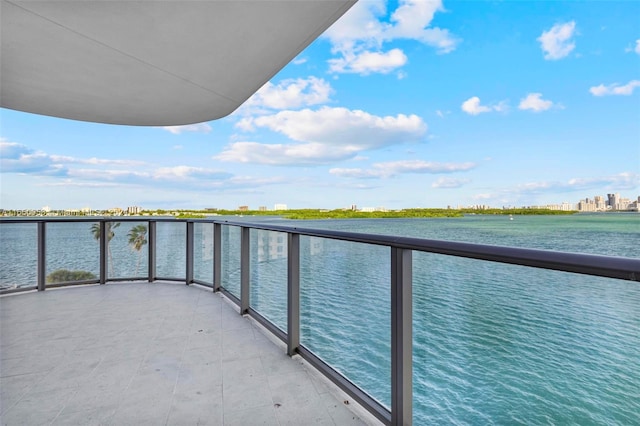 balcony featuring a water view