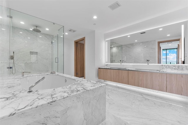 bathroom featuring vanity and plus walk in shower