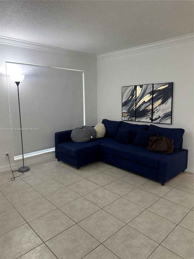 living room featuring ornamental molding, a textured ceiling, and light tile patterned floors