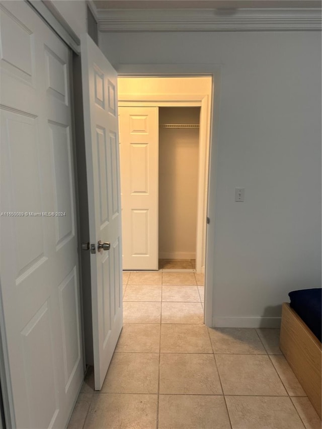 corridor with light tile patterned floors