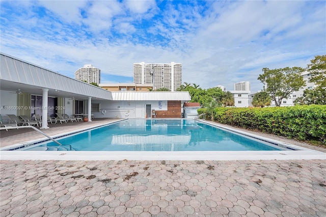 view of swimming pool with a patio area