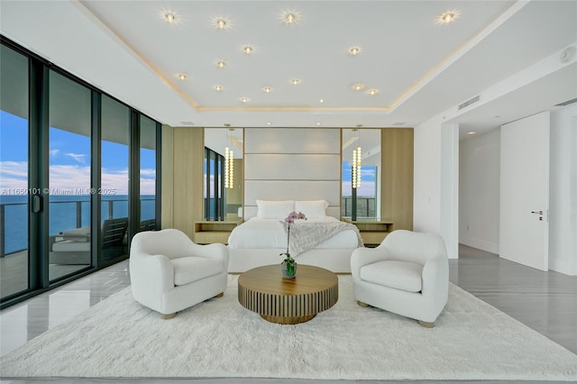 19575 Collins Ave Unit 33, Sunny Isles Beach, FL 33160 - bedroom with expansive windows, access to exterior, a tray ceiling, a water view, and recessed lighting