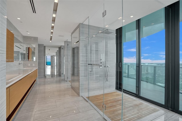 19575 Collins Ave Unit 33, Sunny Isles Beach, FL 33160 - full bath featuring double vanity, a wall of windows, and a stall shower