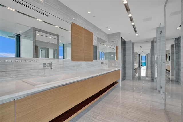 19575 Collins Ave Unit 33, Sunny Isles Beach, FL 33160 - full bath featuring double vanity, a shower stall, and tile patterned flooring